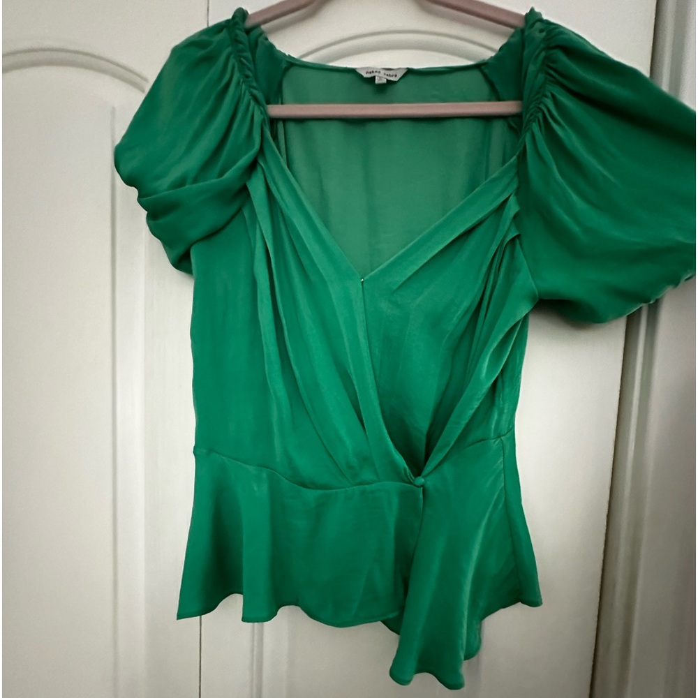 super cute blouse with v-neck and a crossover but small button at the bottom